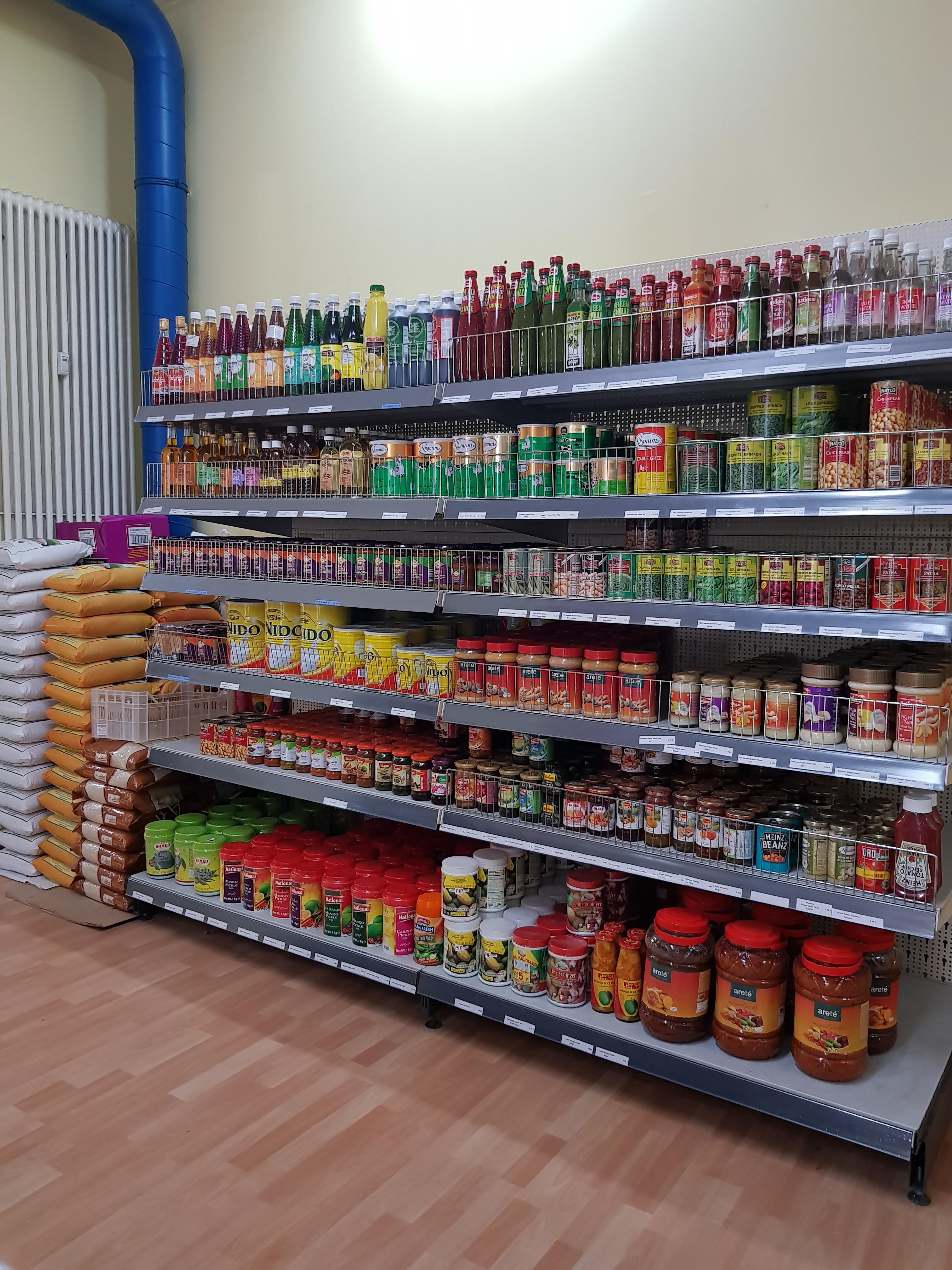 Grocery aisle shelves at Spice Village